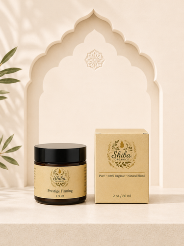 A jar of Shiba Organics Prestige Forming hair wax and its matching outer box, both in beige and black packaging, displayed on a beige surface in front of a decorative beige arch.