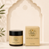A jar of Shiba Organics Prestige Forming hair wax and its matching outer box, both in beige and black packaging, displayed on a beige surface in front of a decorative beige arch.