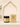 A jar of Shiba Organics Prestige Forming hair wax and its matching outer box, both in beige and black packaging, displayed on a beige surface in front of a decorative beige arch.