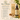 Shiba Organics Nourishing Roots oil with packaging and ingredients on a neutral background