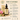 Shiba Organics pure radiance oil with packaging and ingredients on a beige background