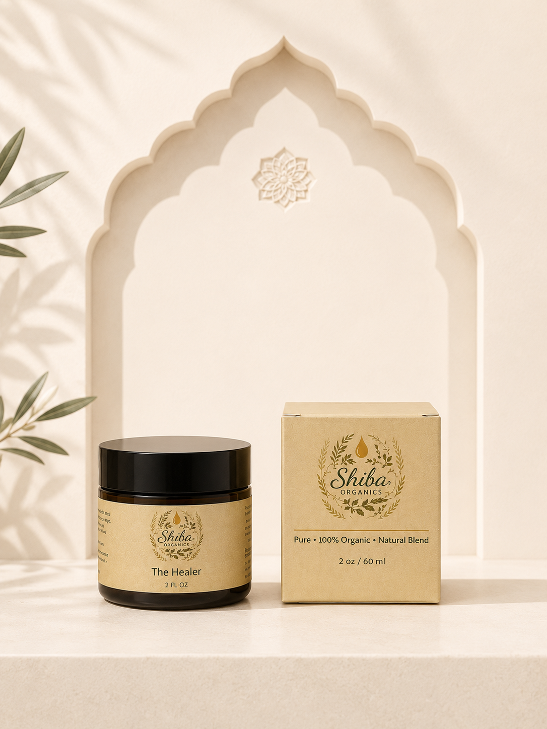 A jar of Shidha Organics 'The Healer' alongside its matching beige packaging box, styled on a marble surface in front of a decorative archway.